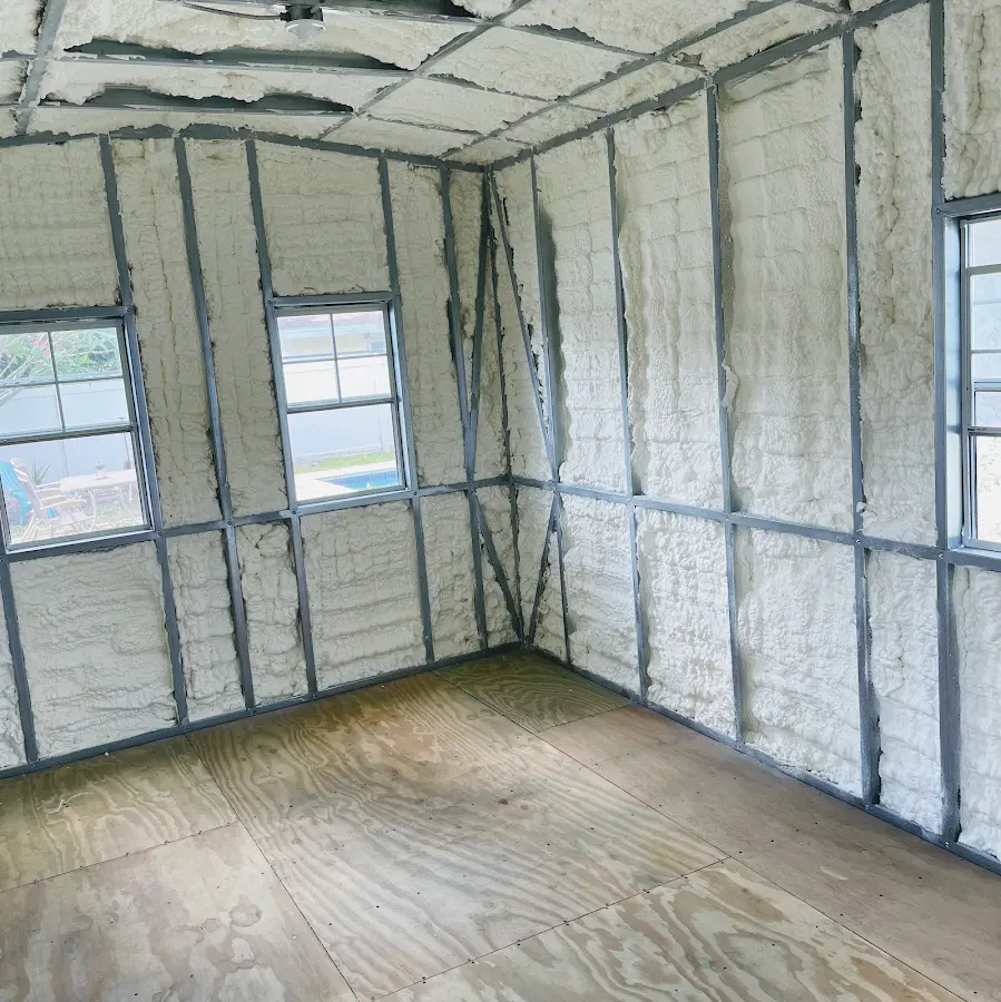 Closed-cell spray foam insulation applied to wall cavities in a residential project in Hyde Park